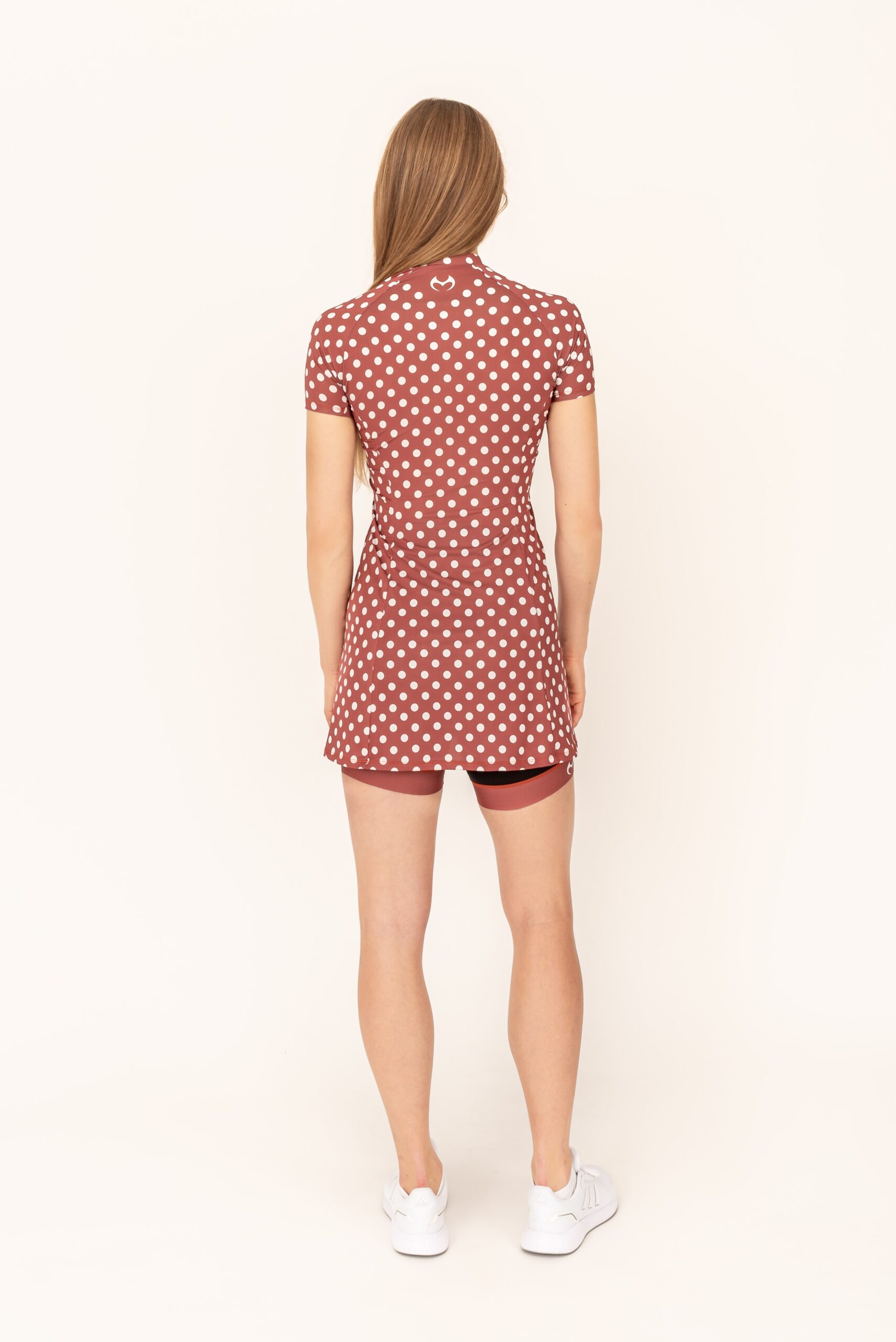 Brown sports dress with white polka dots for exercise and cycling.