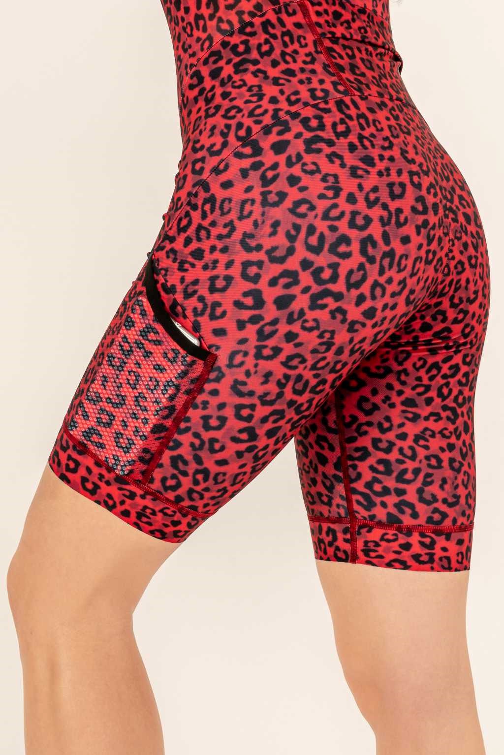 Spacious pockets in a red leopard running skinsuit.